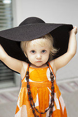 Image showing cute little girl in black hat 