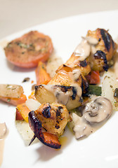 Image showing chicken shish kebab on skewer in mushroom sauce