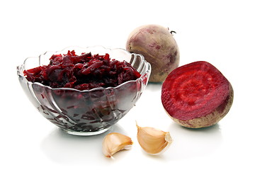 Image showing Salad of roasted beets in glass salad bowl.