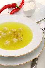 Image showing Dumplings with broth and red chilli.