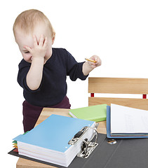 Image showing young child at writing desk