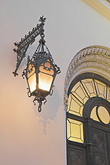Image showing Old lamp on cathedral's wall 