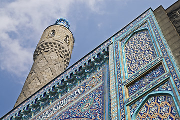 Image showing The minaret and the front wall with Arabic mosaics of the ancien