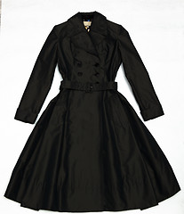 Image showing Black shining a female dress with buttons