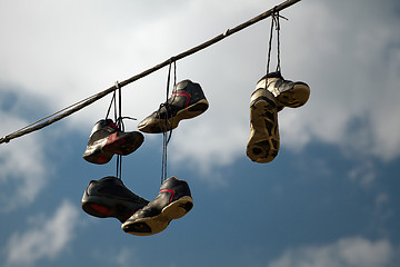 Image showing Sneakers Hanging on a Telephone Line