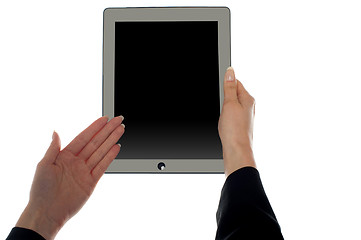 Image showing Female hand showing blank screen of tablet