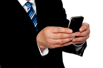 Image showing Cropped image of a man sending message