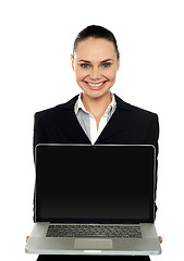 Image showing Female executive presenting brand new laptop