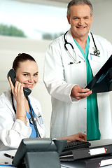 Image showing Two experienced medical representatives posing