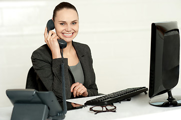 Image showing Cheerful secretary advising her client