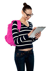 Image showing Attractive teenager working on tablet pc