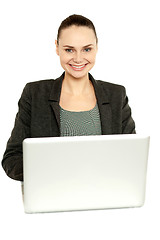 Image showing Attractive corporate female working on laptop