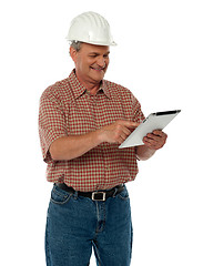 Image showing Aged architect using tablet pc