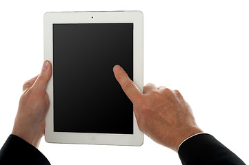 Image showing Finger of a man on tablet pc screen, closeup shot