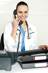Image showing Medical expert communicating on phone