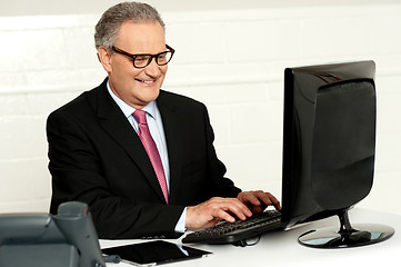 Image showing Casual businessman typing on keyboard