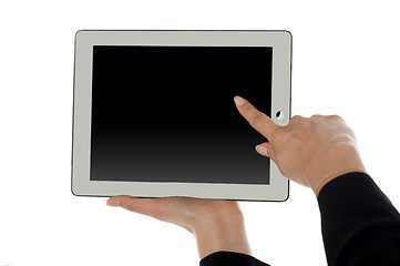 Image showing Female finger pointing at blank screen of tablet pc