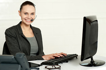 Image showing Female employee assisting customers