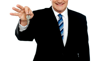 Image showing Cropped image of businessman holding keys