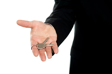 Image showing Businessman offering keys, closeup shot