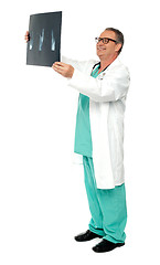 Image showing Full length portrait of senior surgeon holding x-ray