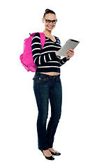 Image showing Smiling college girl using tablet pc