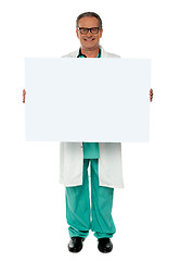 Image showing Senior medical professional displaying banner ad