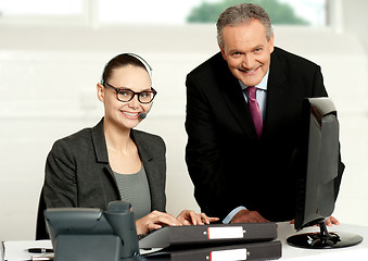 Image showing Cheerful corporate people at work in office