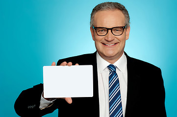 Image showing Businessman in glasses showing placard