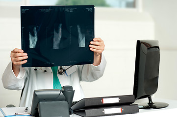 Image showing Male surgeon holding x-ray