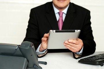 Image showing Cropped image of businessman using tablet pc