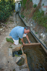 Image showing Getting water