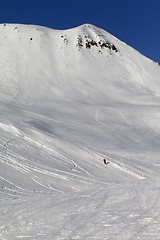 Image showing Skiers on ski piste
