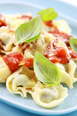 Image showing Small tortellini with tomato sauce and cheese