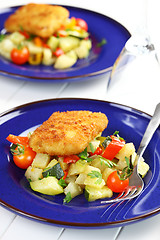 Image showing Fried fish fillet on vegetables