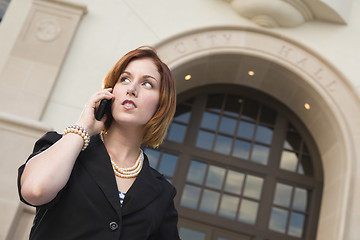 Image showing Young Businesswoman On Cell Phone in Front of City Hall