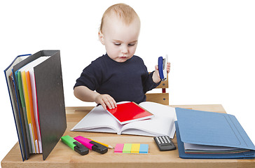 Image showing young child at writing desk