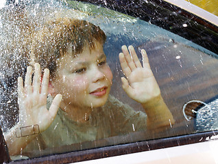 Image showing child and window on a wet rainy day