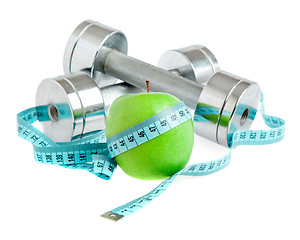 Image showing Dumbbells and apple. A healthy way of life