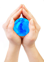 Image showing Hands hold globe