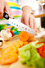 Image showing Woman's hands cutting vegetables