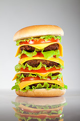 Image showing Tasty and appetizing hamburger on a grey