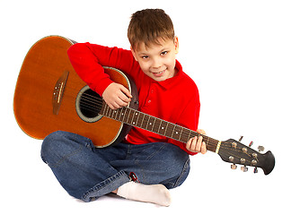 Image showing The boy with an acoustic guitar on a white background 