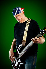 Image showing man with a guitar, bass player