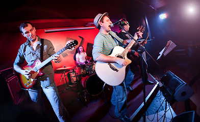 Image showing musician plays a guitar