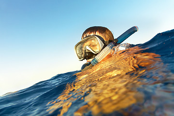 Image showing boy floats in the sea