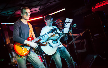 Image showing musician plays a guitar