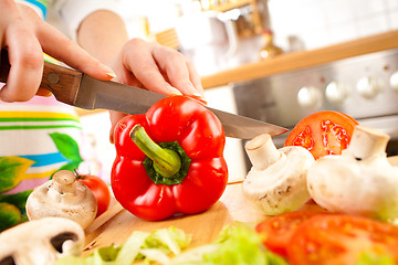 Image showing Woman's hands cutting vegetables