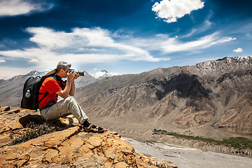 Image showing Photographer on the high mountain