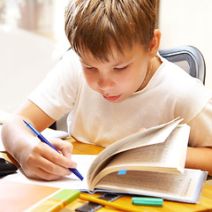 Image showing boy behind a desk